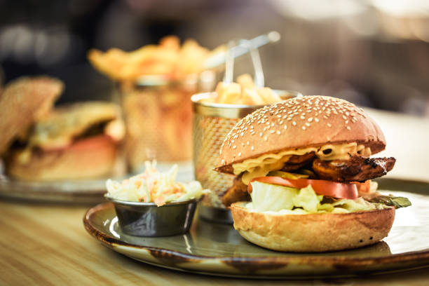 Fast food, french fries with a sandwich in a cafe, fast food concept